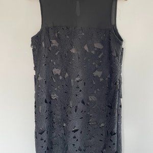 Black lace dress with flower details.